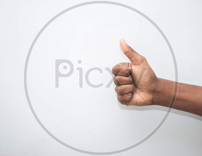 Thumbs Up Sign - Male Hand Showing Thumbs Up Sign Isolated On White Background. Hand Symbol Sign Language.