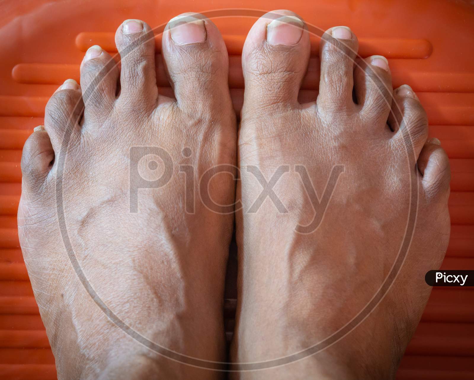 Male Feet Waiting For Pedicure To Be Done