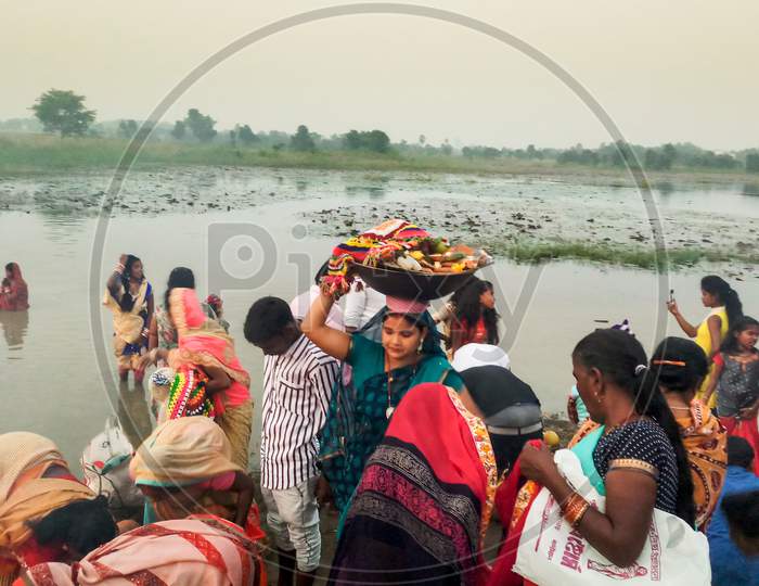 A group of people is celebrating the Chhath Puja