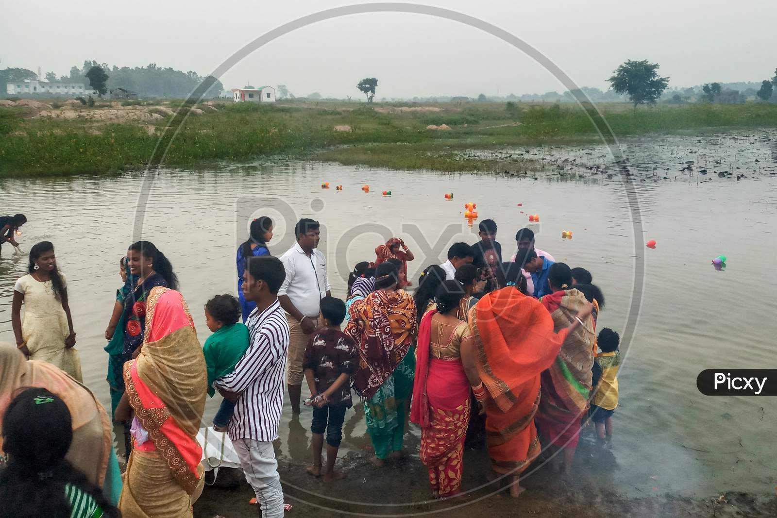 A group of people is celebrating the Chhath Puja
