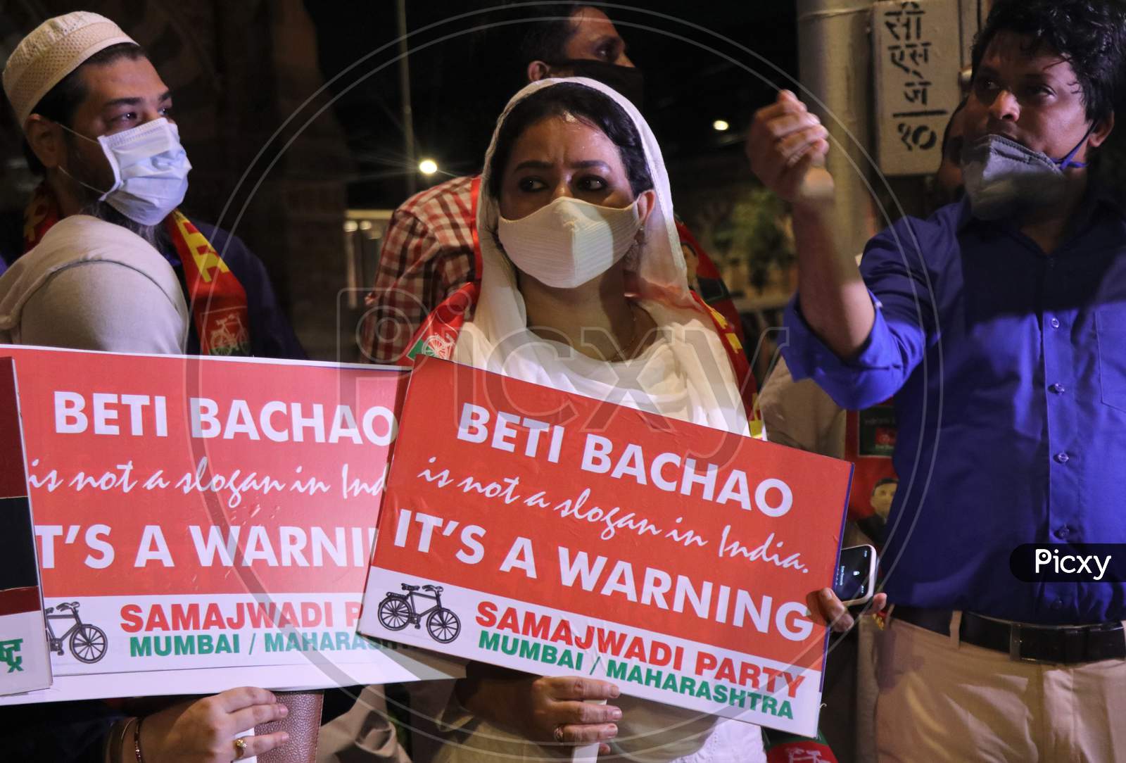 Women hold placards during a protest after the death of a rape victim, on a street in Mumbai, India, September 30, 2020.