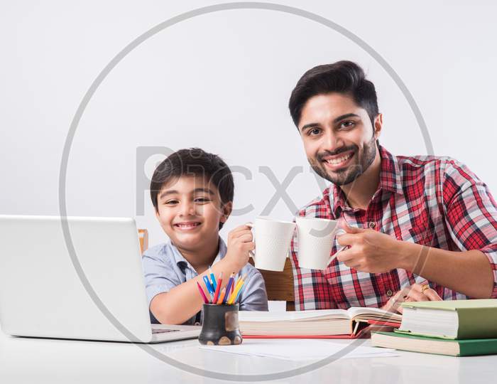 Online School In India Concept - Cute Little Son Taking Father'S Help In Studies Or Homework