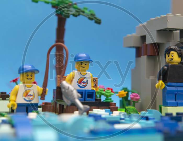 Florianopolis, Brazil. September 20, 2020: Twin Brothers And Father Minifigure Fishing On A Beautiful Sunny Day. Day Of Rest And Relaxation - Contact With Nature. Selective Focus.