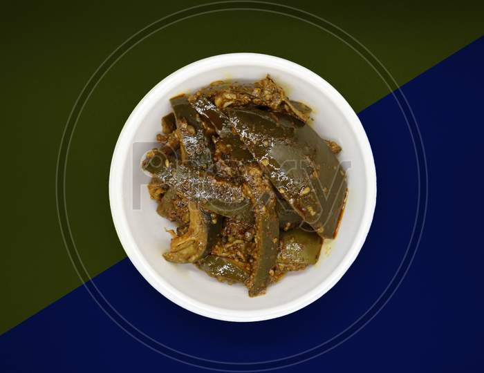 Homemade Mango Pickle or Aam ka Achar Or Kairi Loncha in a bowl, selective focus