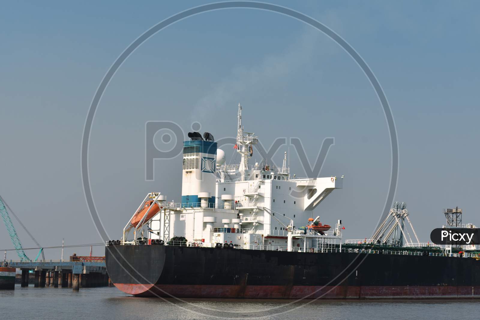 Merchant Ship Waiting For Departure From Its Port