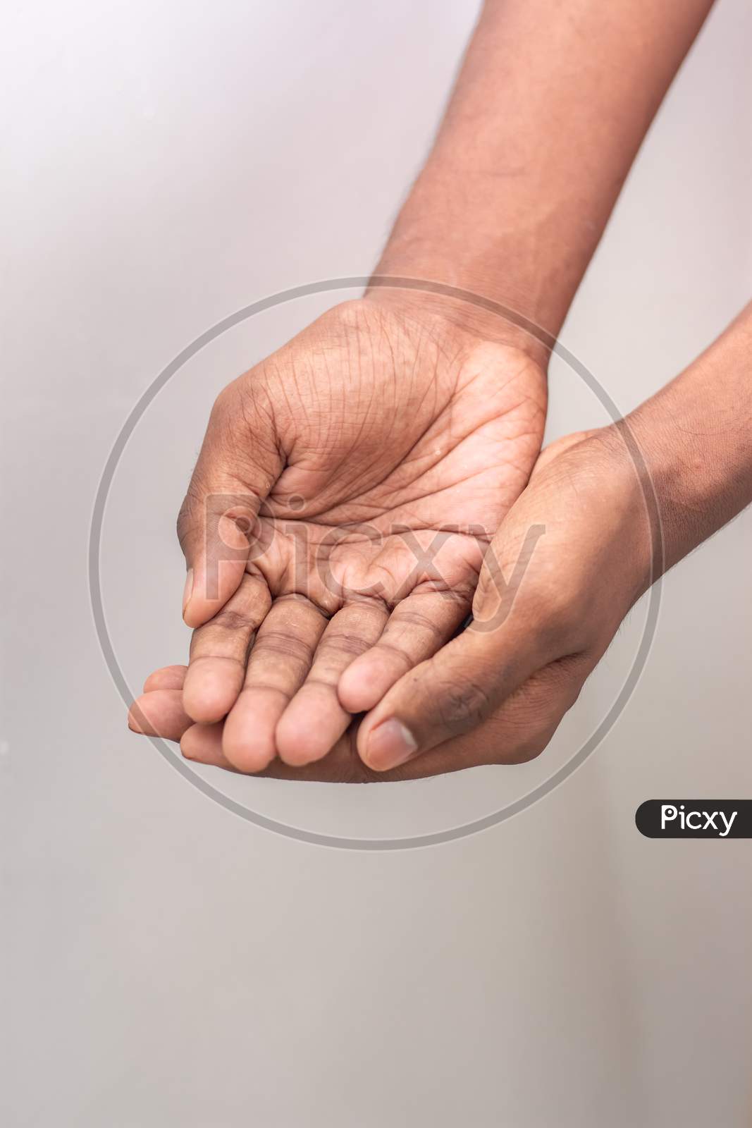 Beggar Hand Signs - Hand Man Holds A Handful, Hands Together. Two Hands With Open Palms Both Tightly Together - International Hand Gesture Isolated On White Background With Copy Space