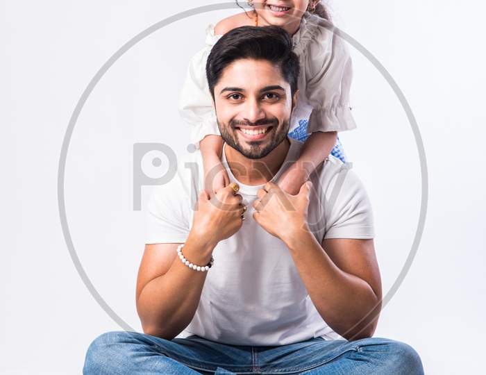Father'S Day Concept - Indian Young Dad With Cute Little Daughter Against White Background