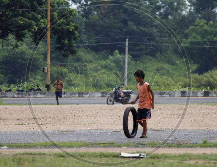 Kids playing with tyre