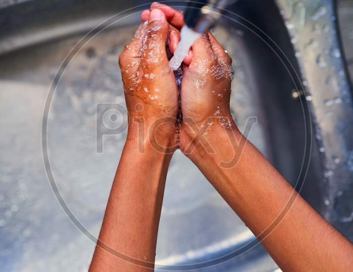 Female Hands Washing In Basin. Top Of View