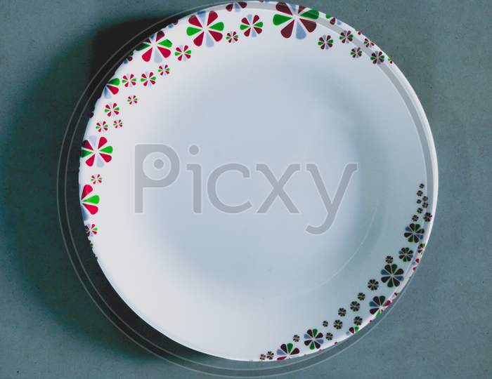 Beautiful and colourful plate with blueish background.