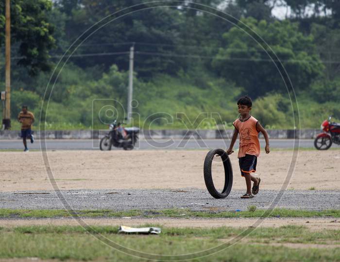 Kids playing with tyre
