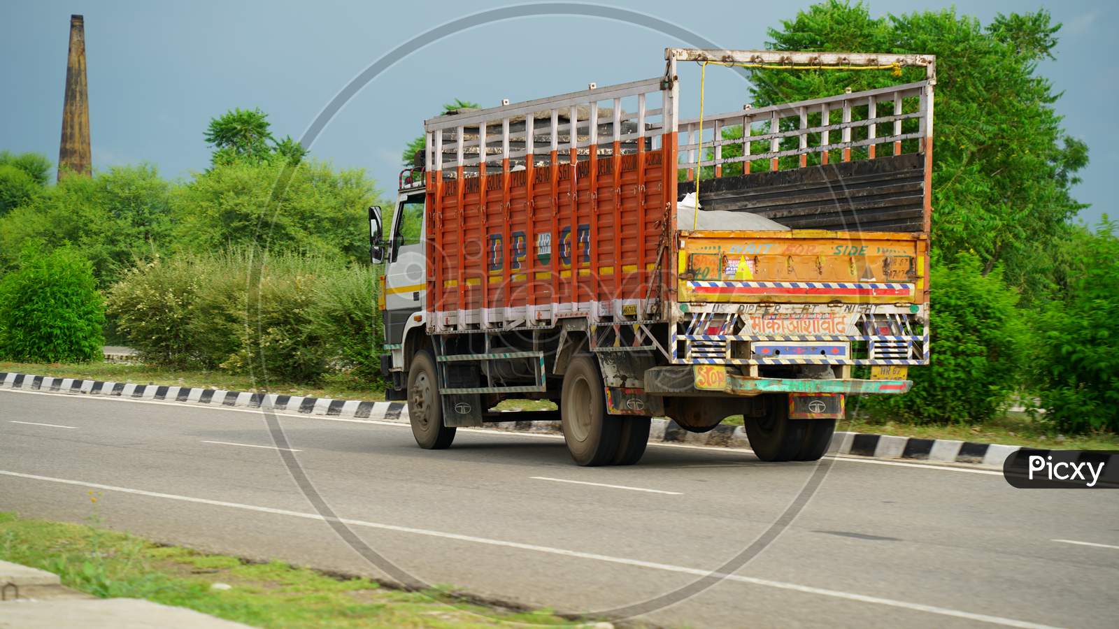 Truck on highway road with red container, transportation concept.,import,export logistic industrial Transporting Land transport on the asphalt expressway