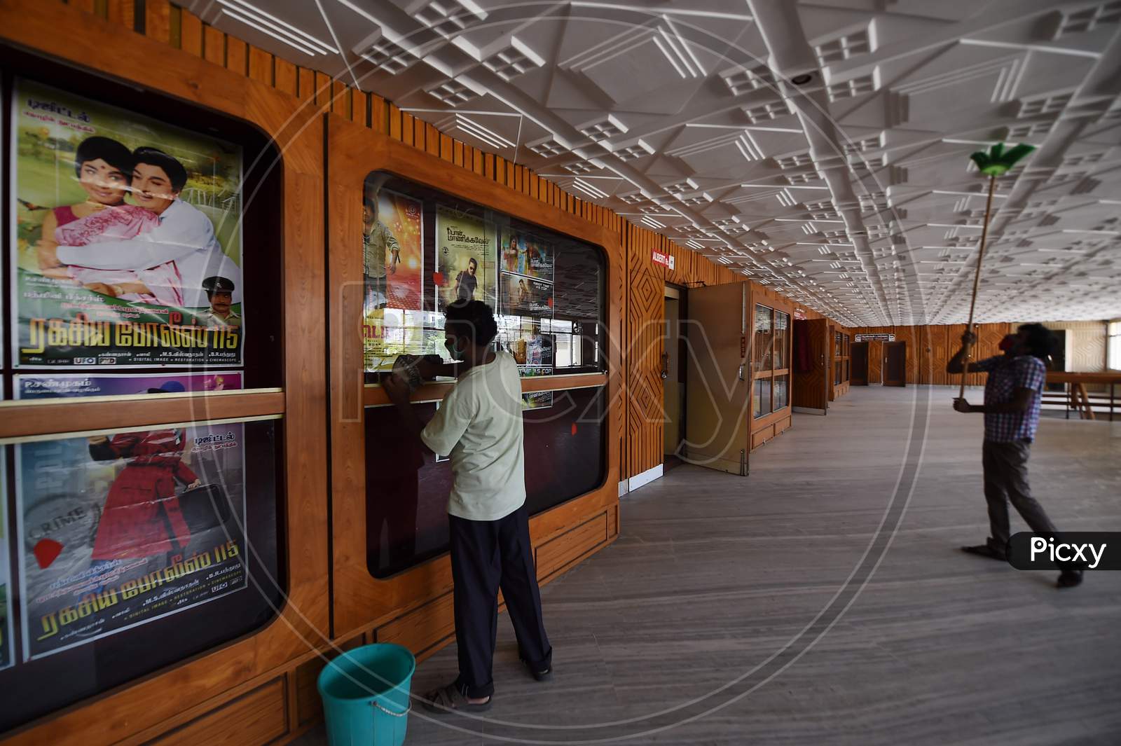 A Worker Cleans A Cinema Hall Ahead Of Its Reopening, During Unlock 5, Amid The Coronavirus Pandemic, In Chennai, Fridayday, Oct.9, 2020