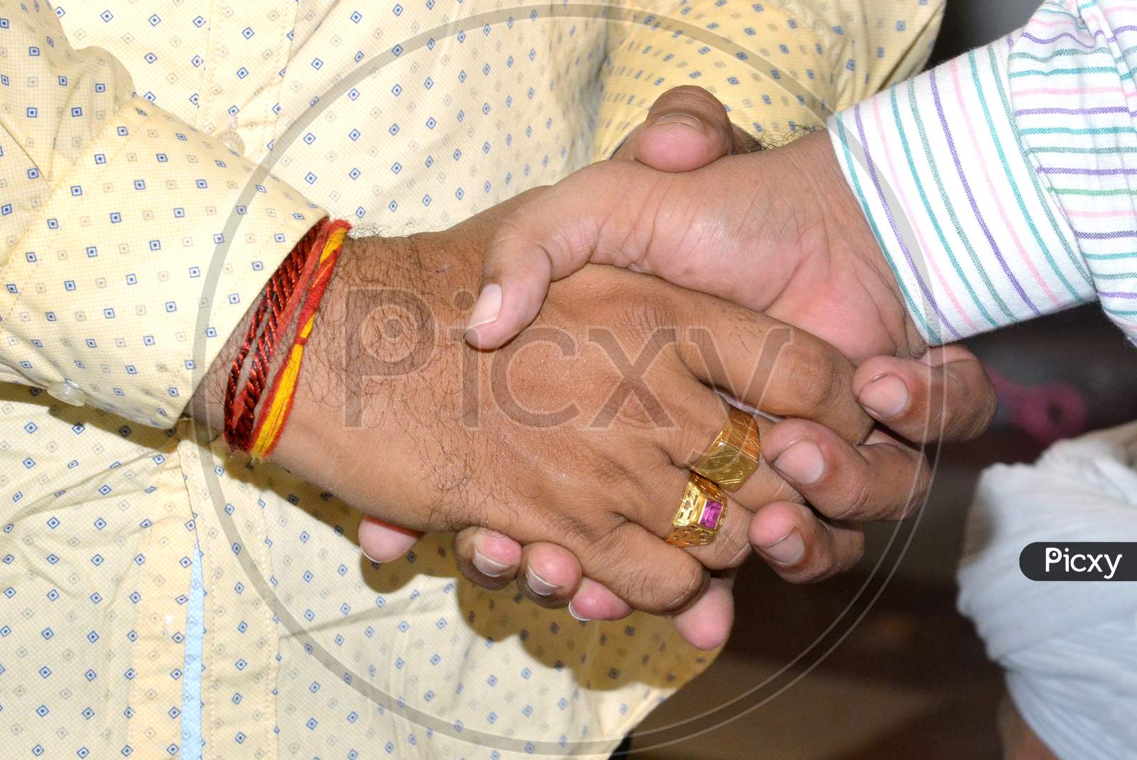 Closeup Shot Of Two Businessmen Shaking Hands Together