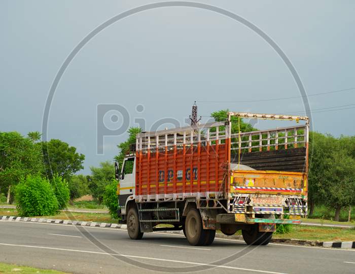 Truck on highway road with red container, transportation concept.,import,export logistic industrial Transporting Land transport on the asphalt expressway