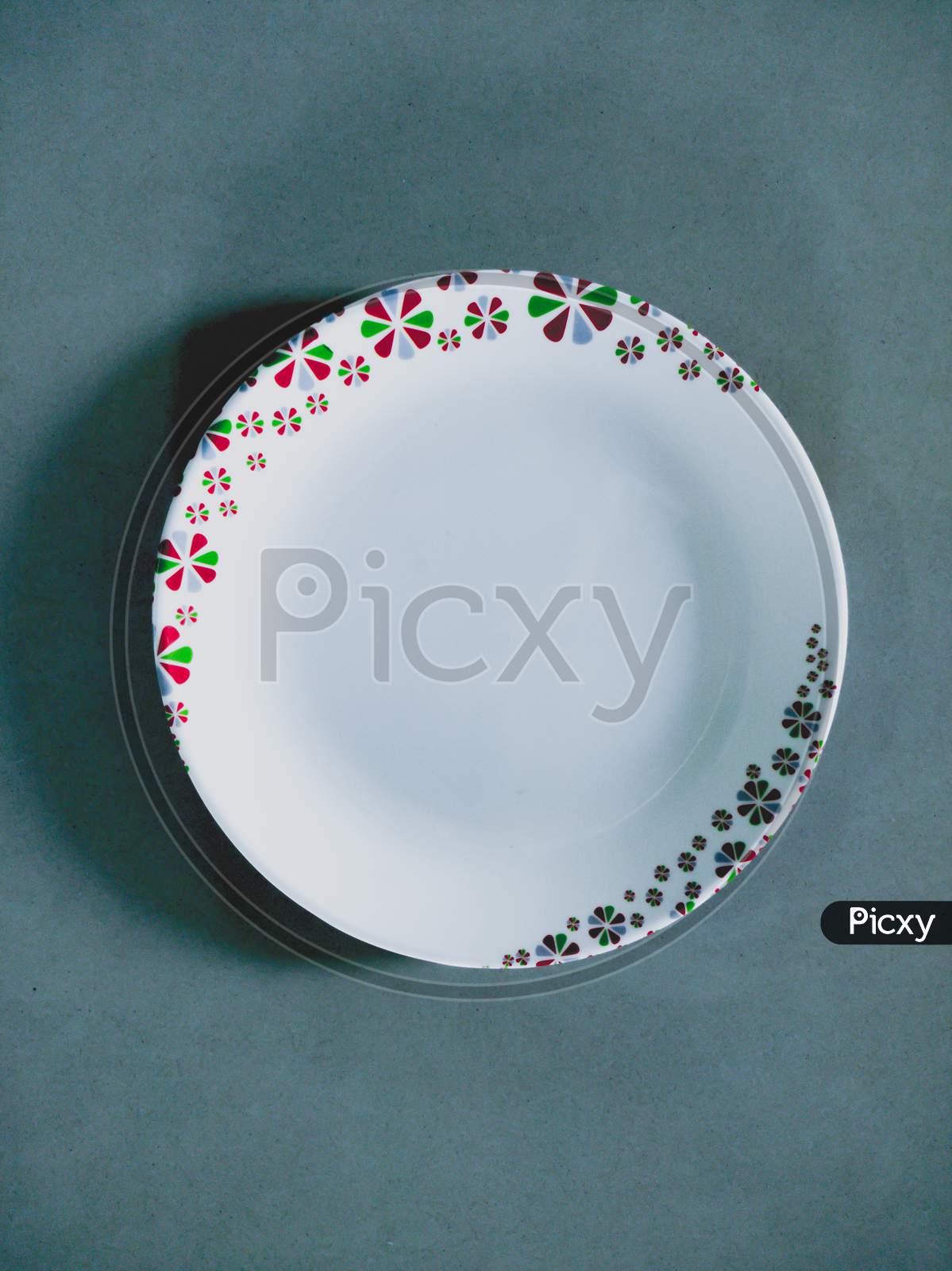 Beautiful and colourful plate with blueish background.