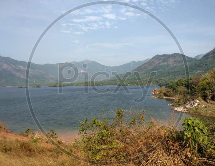 Kanjirapuzha dam reservoir and surrounding mountains