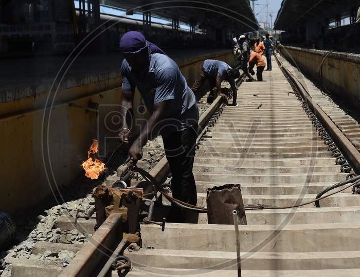 Workers Repair Metal Tracks At A Platform At Central Railway Station As Part Of The Preparations To Reopen The Station Under The Government'S Decision To Ease The Lockdown Put As A Preventive Measure Against The Covid-19 Coronavirus, In Chennai On Friday.Oct.9.2020,