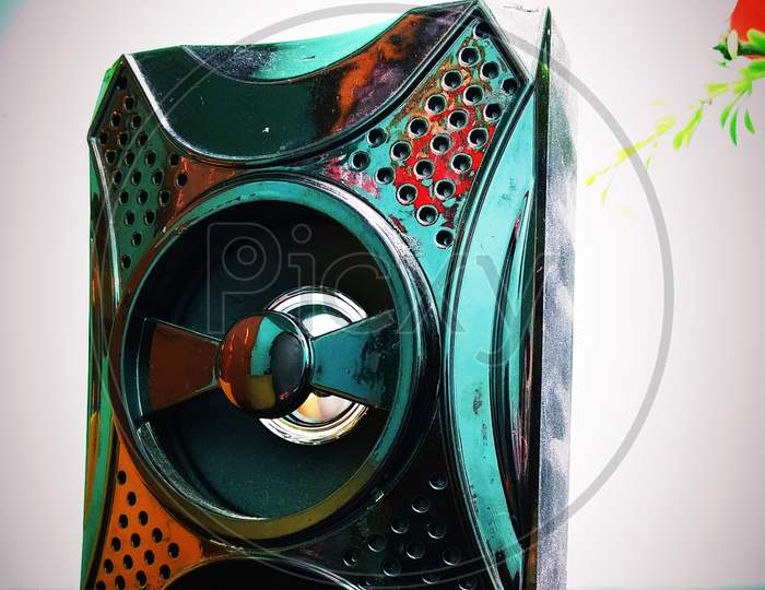 Colourful sound speaker in gray background