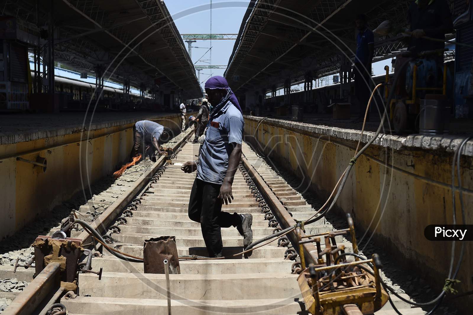 Workers Repair Metal Tracks At A Platform At Central Railway Station As Part Of The Preparations To Reopen The Station Under The Government'S Decision To Ease The Lockdown Put As A Preventive Measure Against The Covid-19 Coronavirus, In Chennai On Friday.Oct.9.2020,