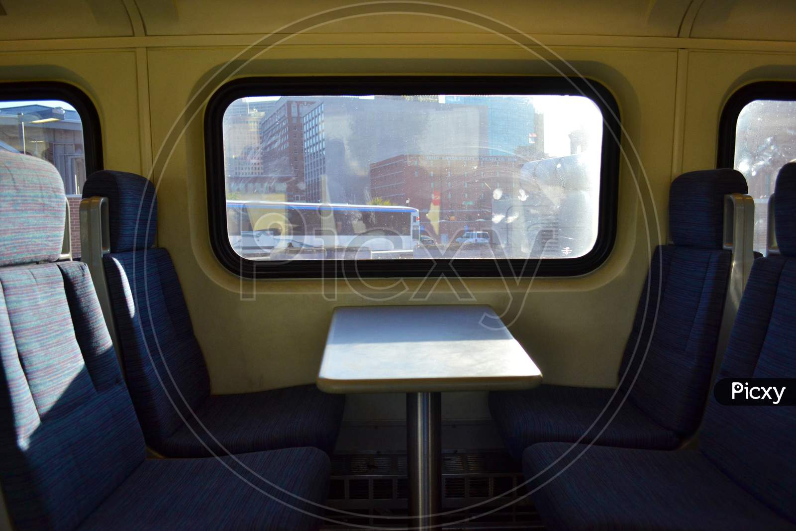 Empty Train Seats by the Window