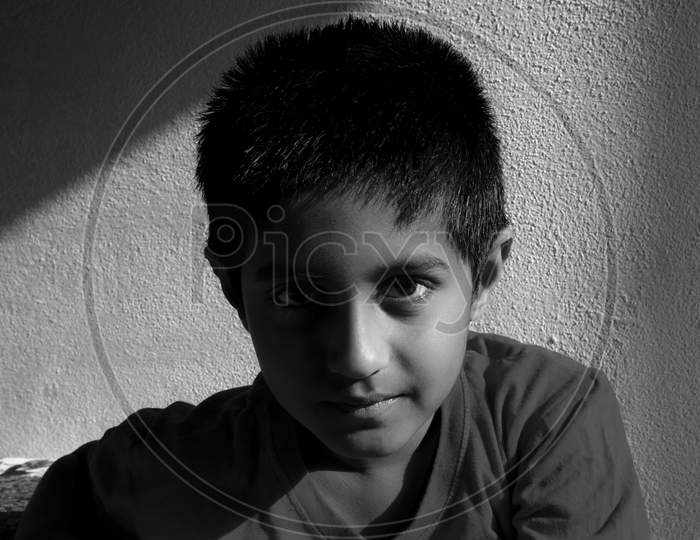 Close Head Shot Of Indian Boy Low Key Light In The Morning Monochrome Photo