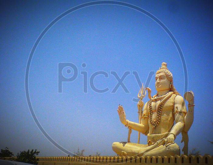 Statue of Hindu god Lord Shiva near Nageshwar, Dwarka in Gujarat on the bank of arabian sea.