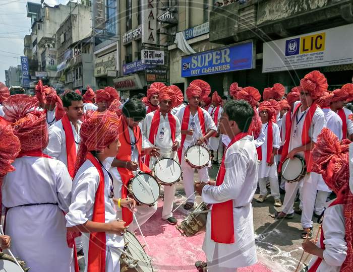 Group Of Youths Beating Traditional Tasha Collectively During Ganesh Festival.