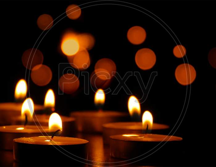 Illuminated oil lamp on blurred bokeh background for Diwali festival