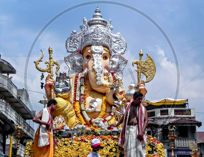 Decorated & Garlanded Huge Idol Of Hindu God Ganesha During Festival Procession.