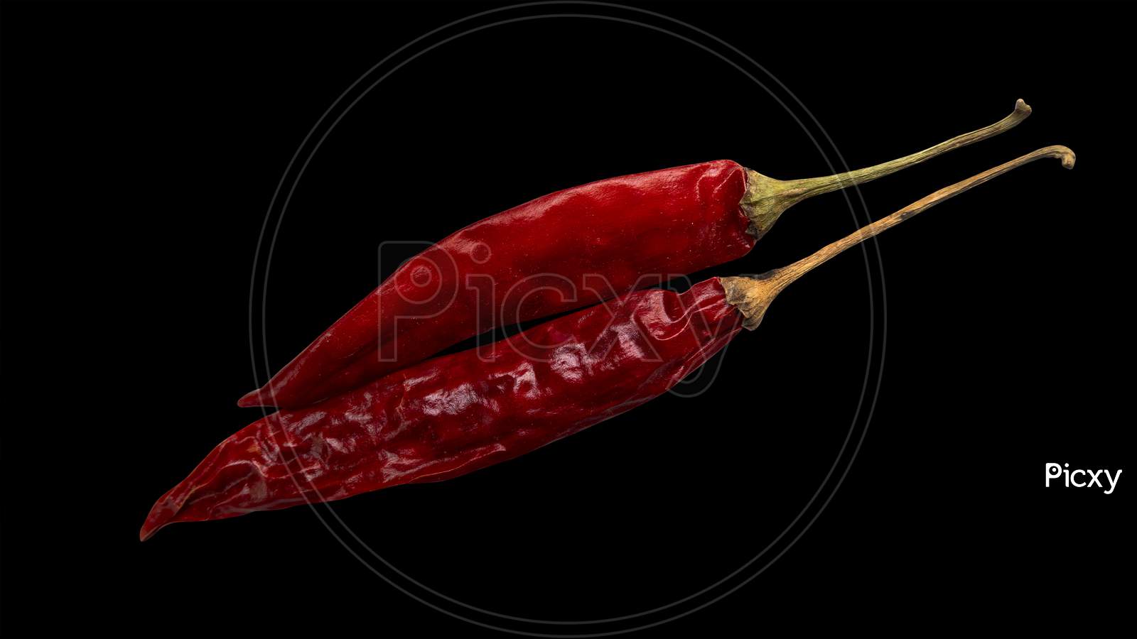 Top Shot Of Red Chillies Isolated On Black Background