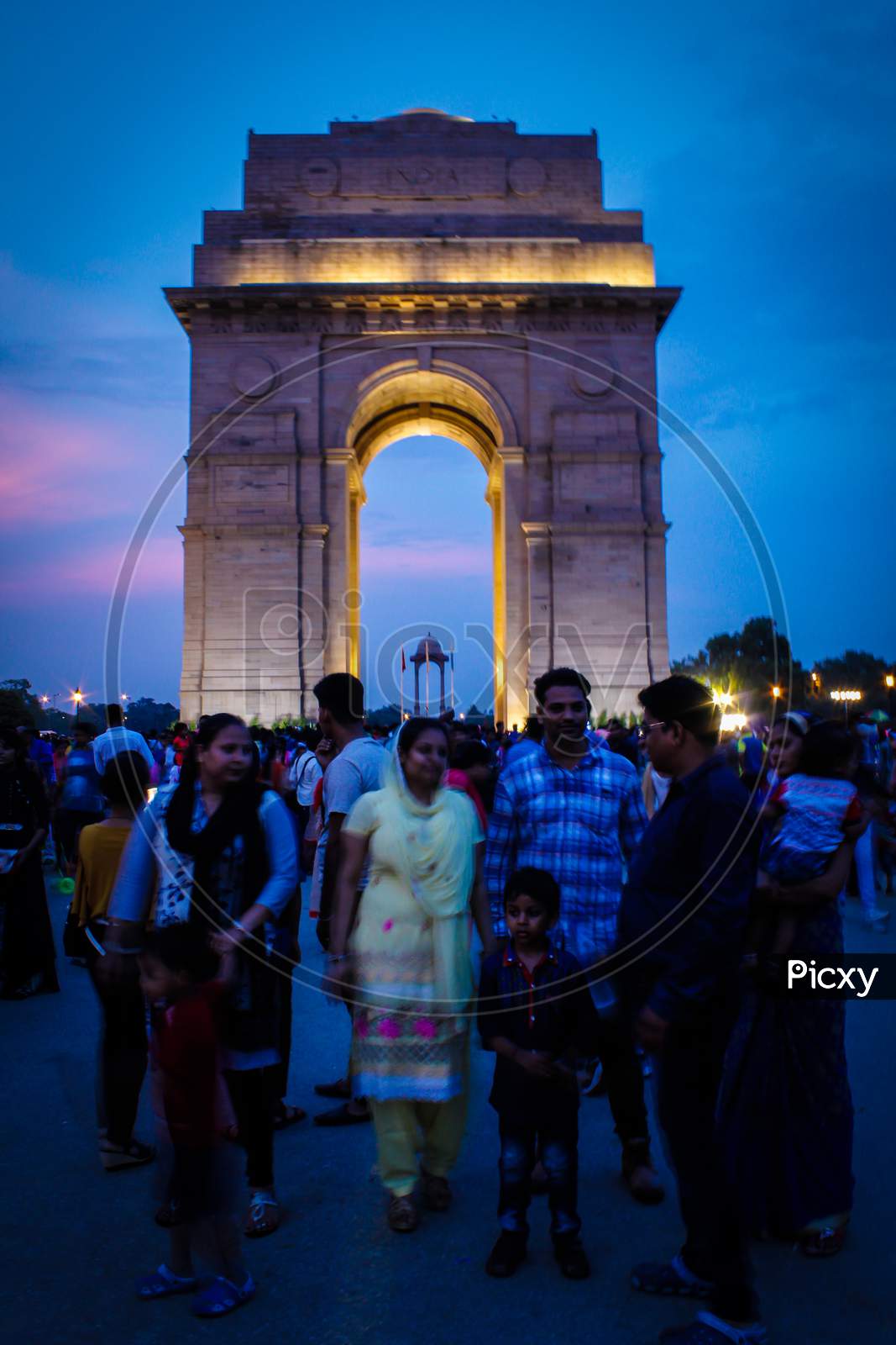 Evening View Of Tourist On Historical Place India Gate.