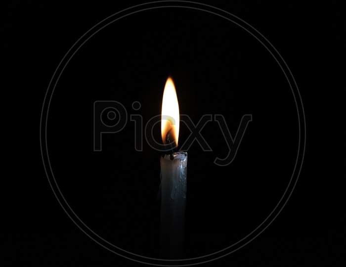 Close up single candle flame in diwali festival