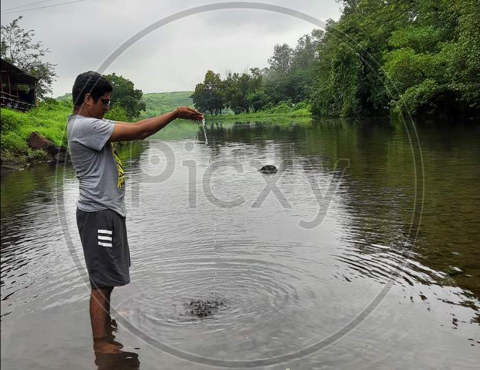 Man standing in river