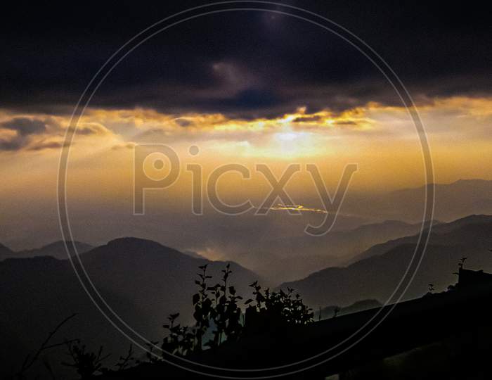 Heavenly Atmosphere with Clouds and Beautiful Sunset and Hills