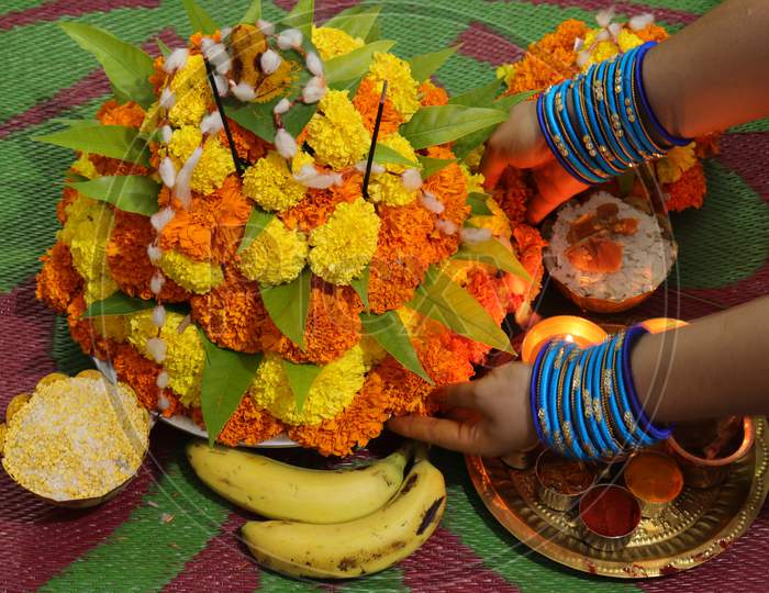 colorful flowers stacked up to create bathukamma, a specific hindu god worshiped in south india