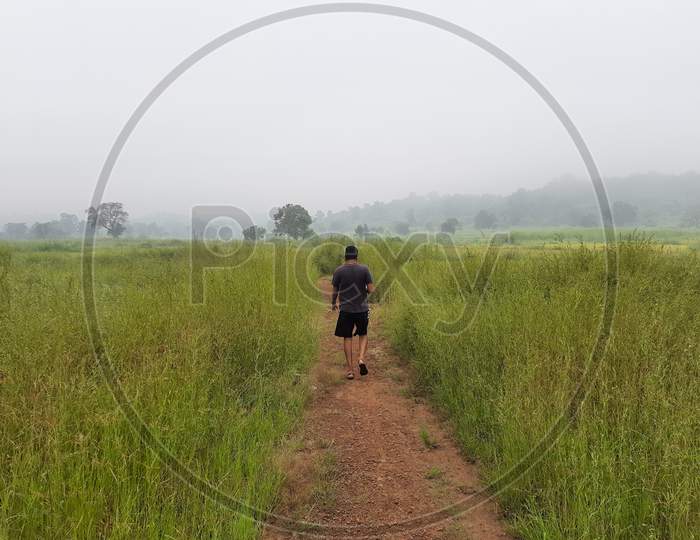 Man walking on village road