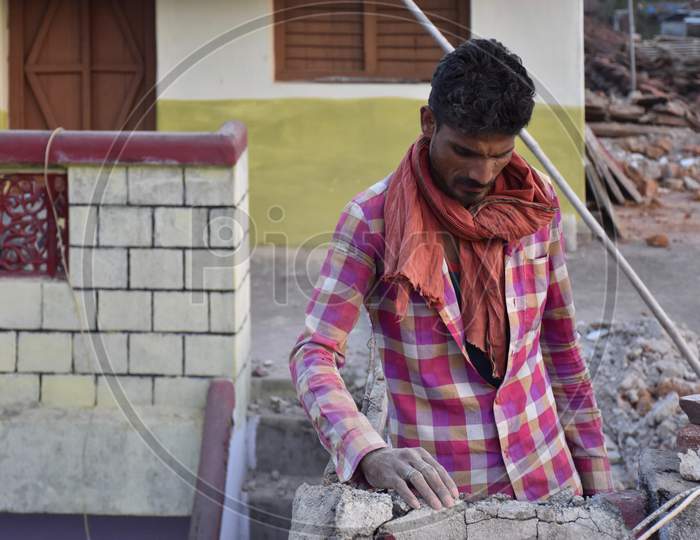 A Man Doing House Construction
