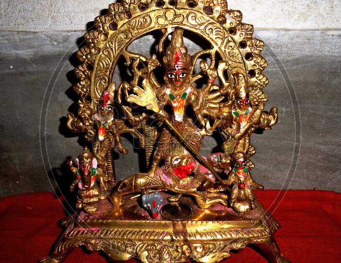 Brass sculpture of hindu goddes durga at her Mahishasura Mardini posture