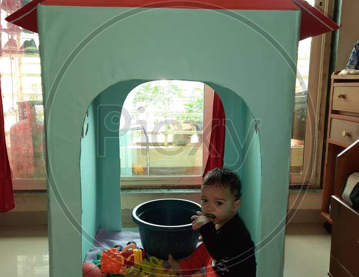 Child playing inside tiny home