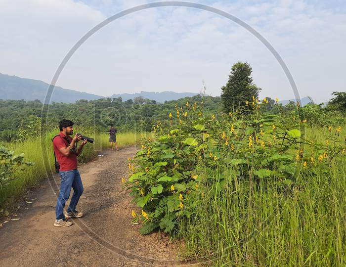 Man taking photos of nature