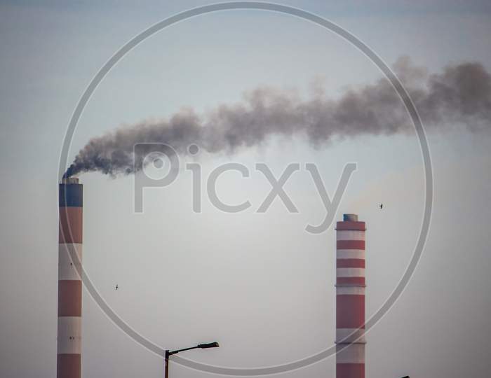 Industrial Landscape - Smoke From The Pipes Of Heat Station With Carry Out Harmful Emissions.Petrochemical Factory Chimney.Its Held To Increasing Global Warming. Pollution City Chemical Industries.