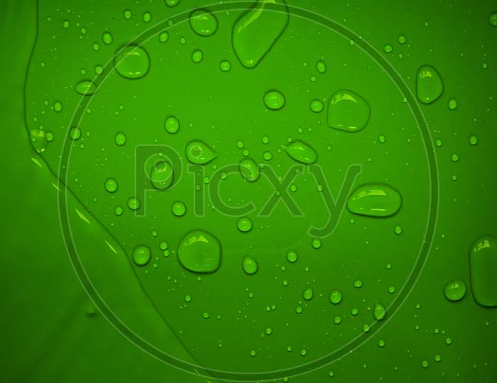 Image Of Water Drops On Green Plastic Surface