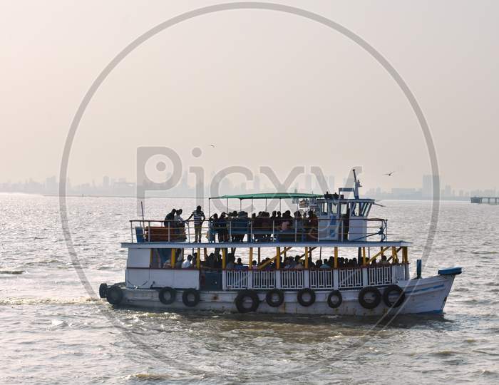 A Boat Full Of Passenger Returning To Port Near Mumbai