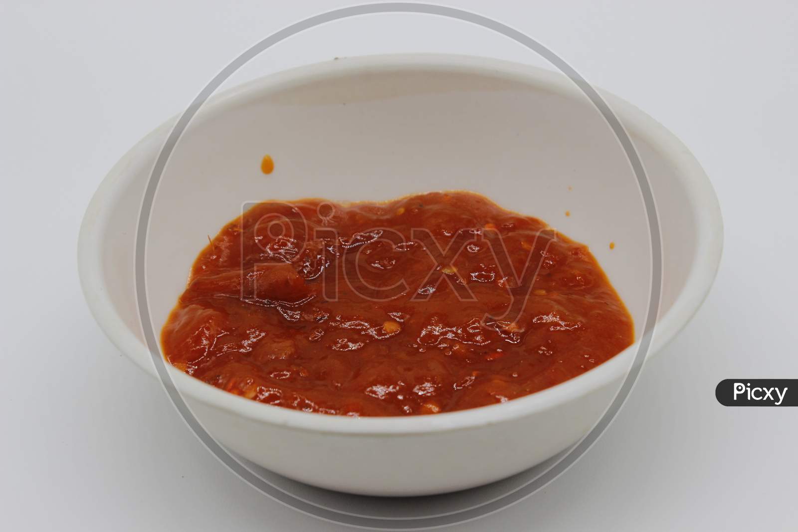 A Picture Of Tomato Sauce In Bowl