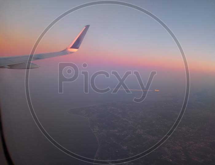 Horizon with colorful sky during air travel