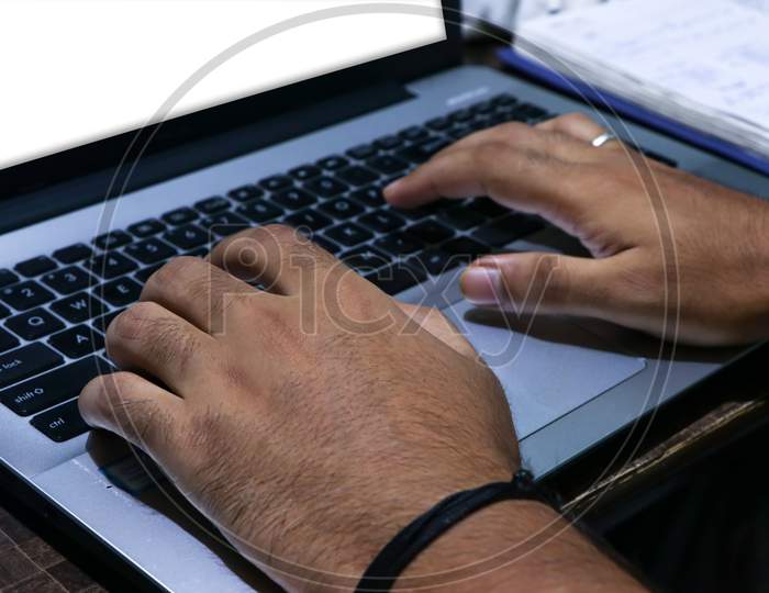 Closeup Shot Of Male Hands Working With A Laptop