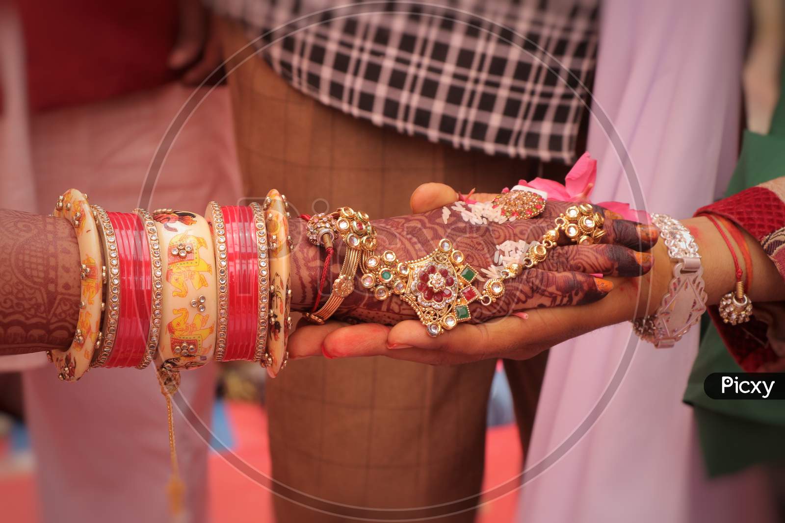 a photo of indian wedding,.A couple are holding hand each other