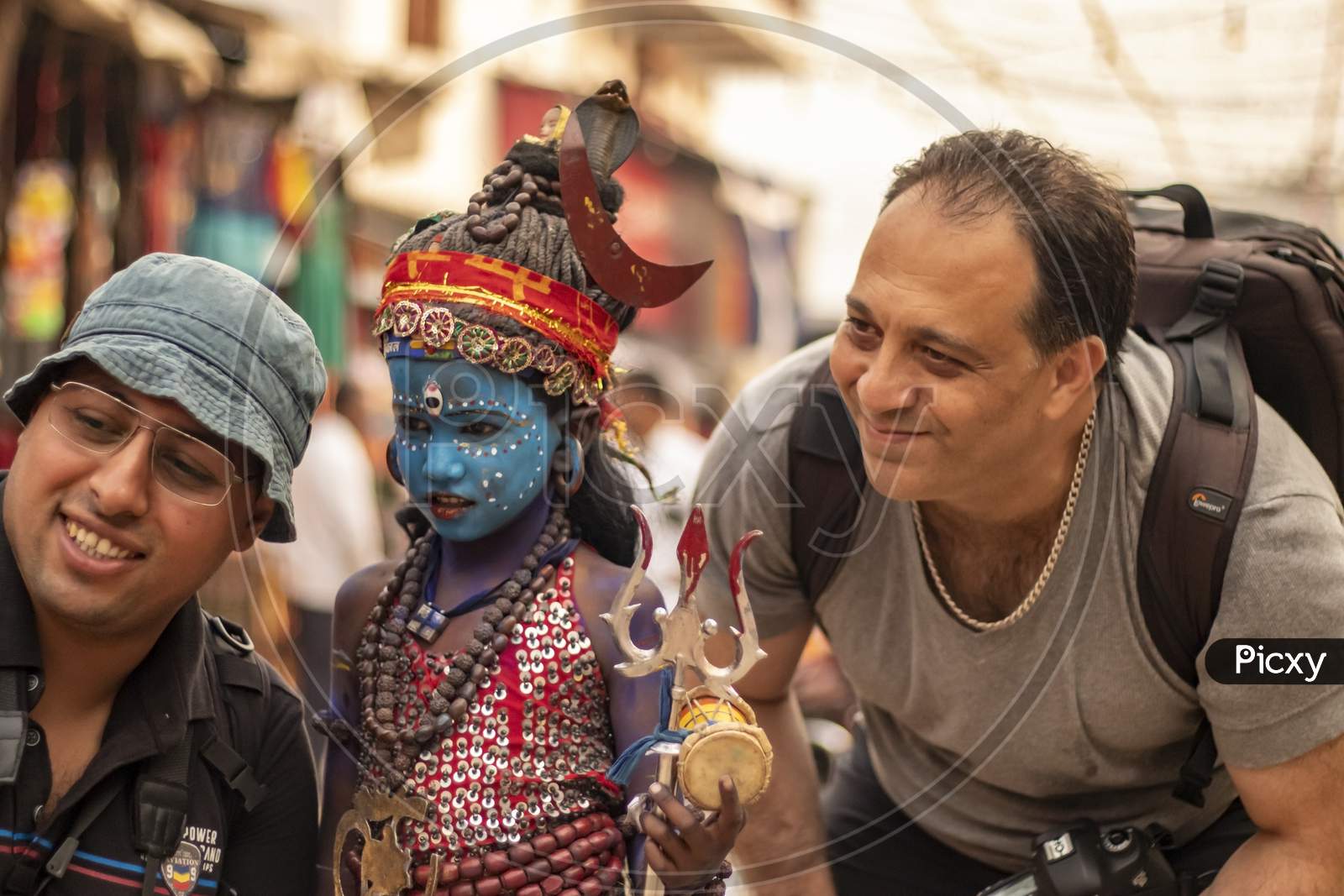 A poor kid dressed as lord Shiva became center of attraction among tourists in Pushkar Fair