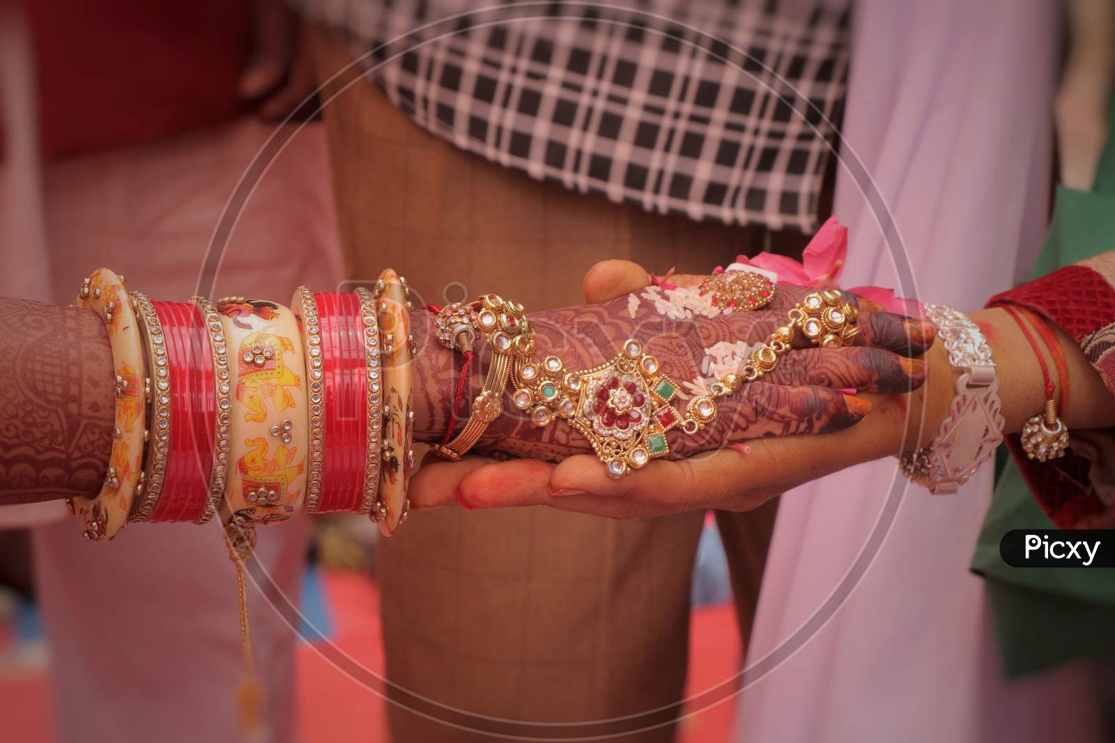 a photo of indian wedding,.A couple are holding hand each other.